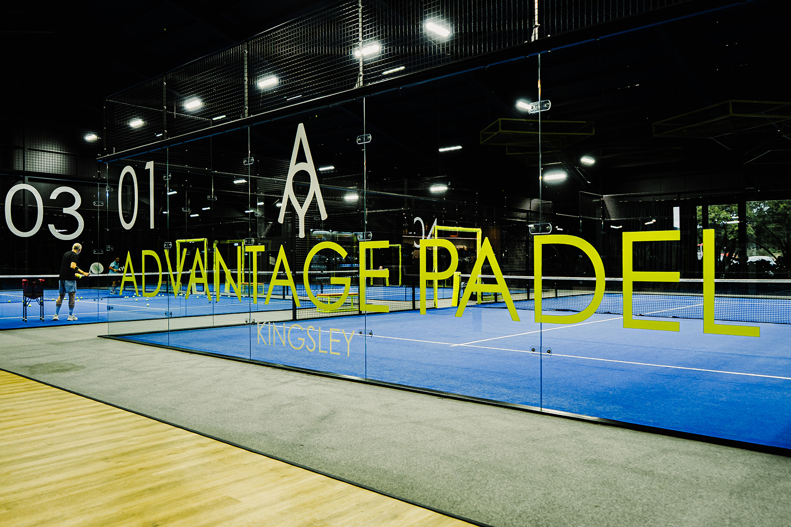 Indoor courts seen through the glass at Advantage Padel Kingsley